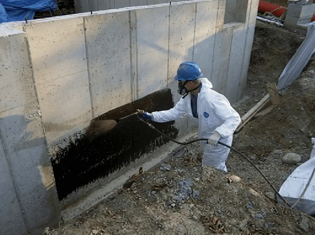 Professional waterproofing the exterior walls of the basement in Omaha, NE
