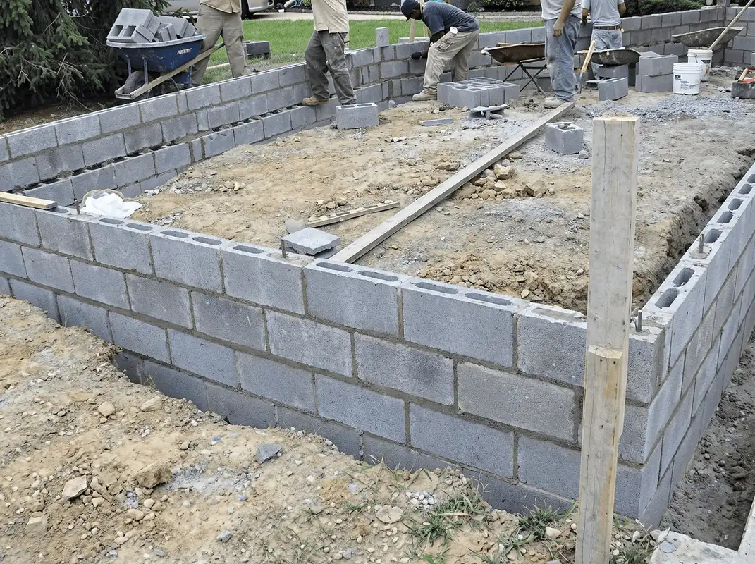 Professionals building a foundation with blocks in Omaha, NE