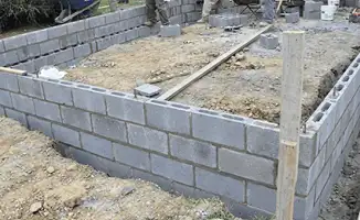 Professionals building a foundation with blocks in Omaha, NE