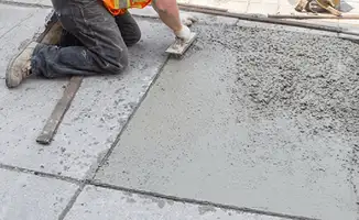 Professional repairing a concrete floor in Omaha, NE